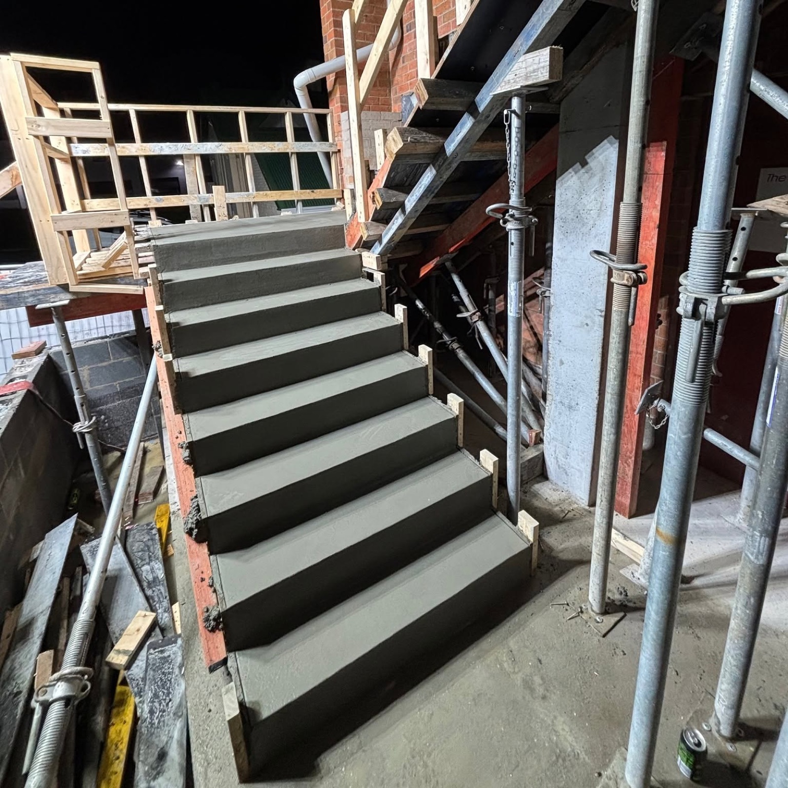 A concrete staircase formed and poured on a commercial site